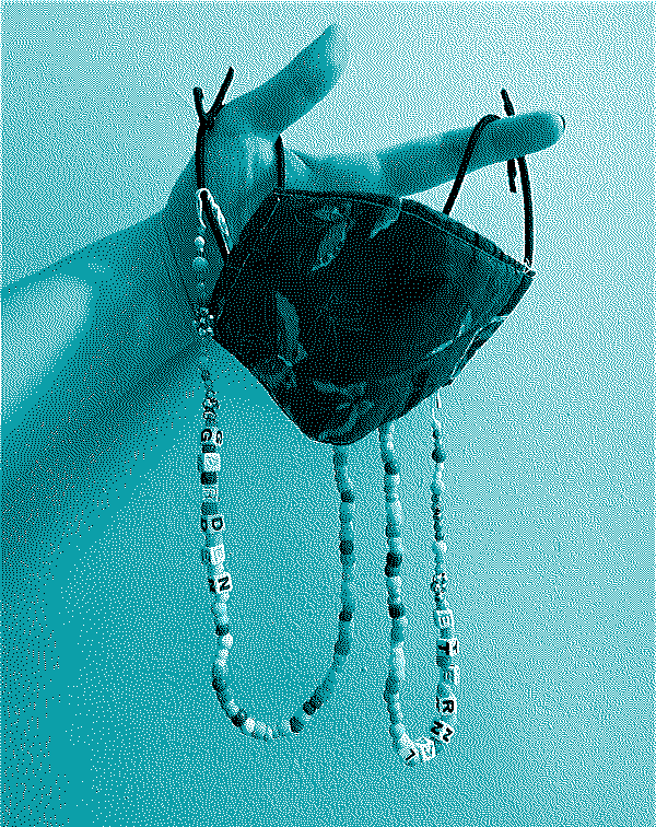 A beaded chain with the words garden on one side and eternal on the other. A beaded chain with the words garden on one side and eternal on the other.